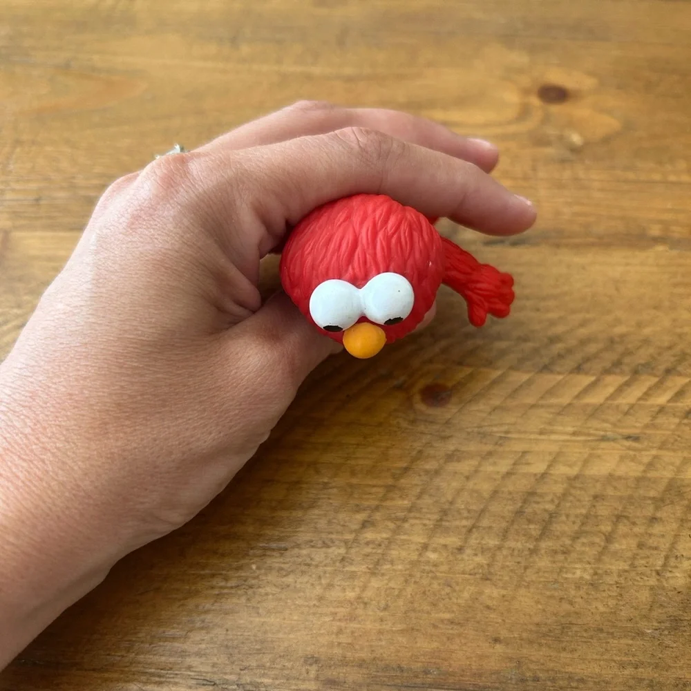 Applause Elmo figurine as is can be used as a cake topper
